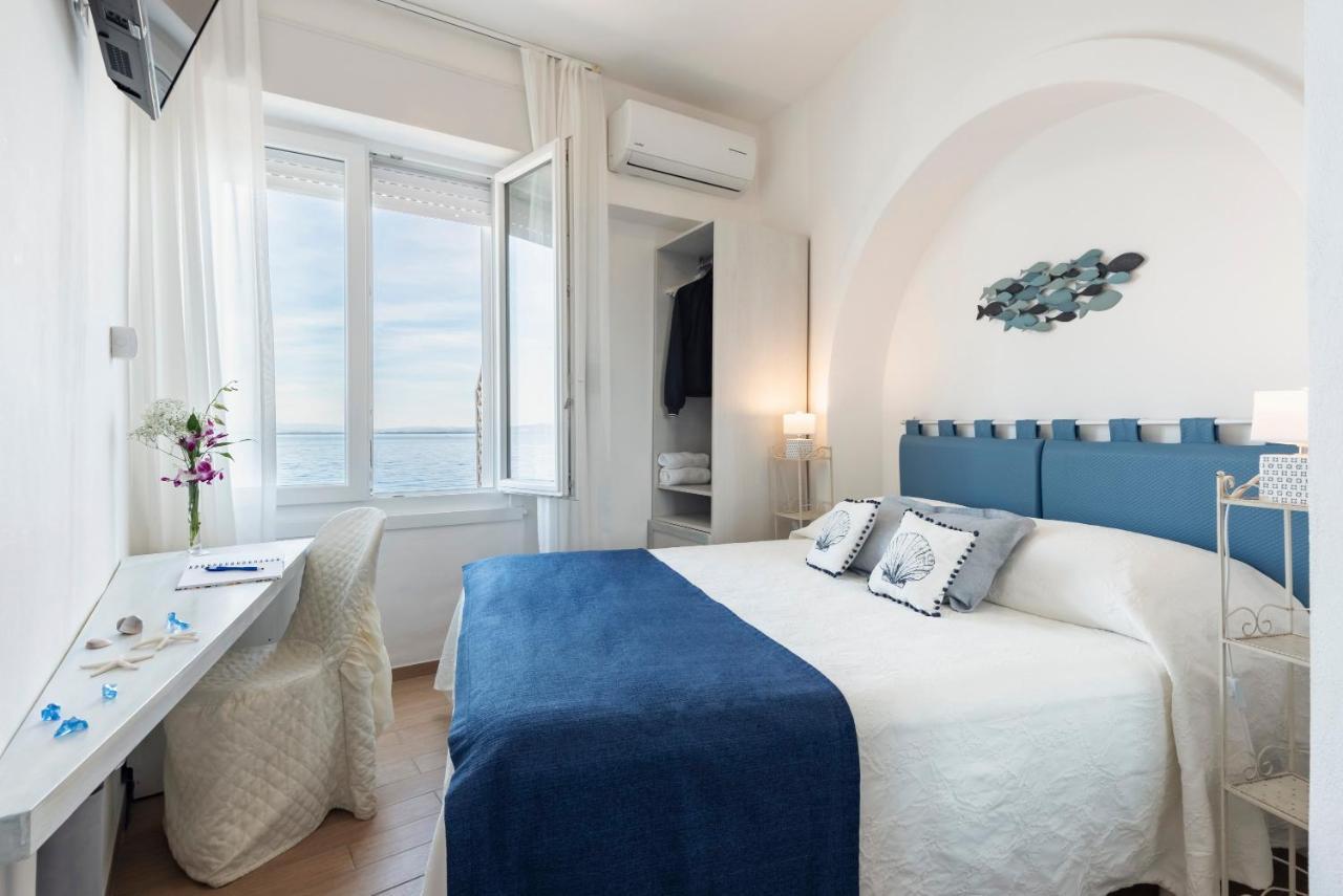Hotel La Caletta Порто Санто Стефано Экстерьер фото