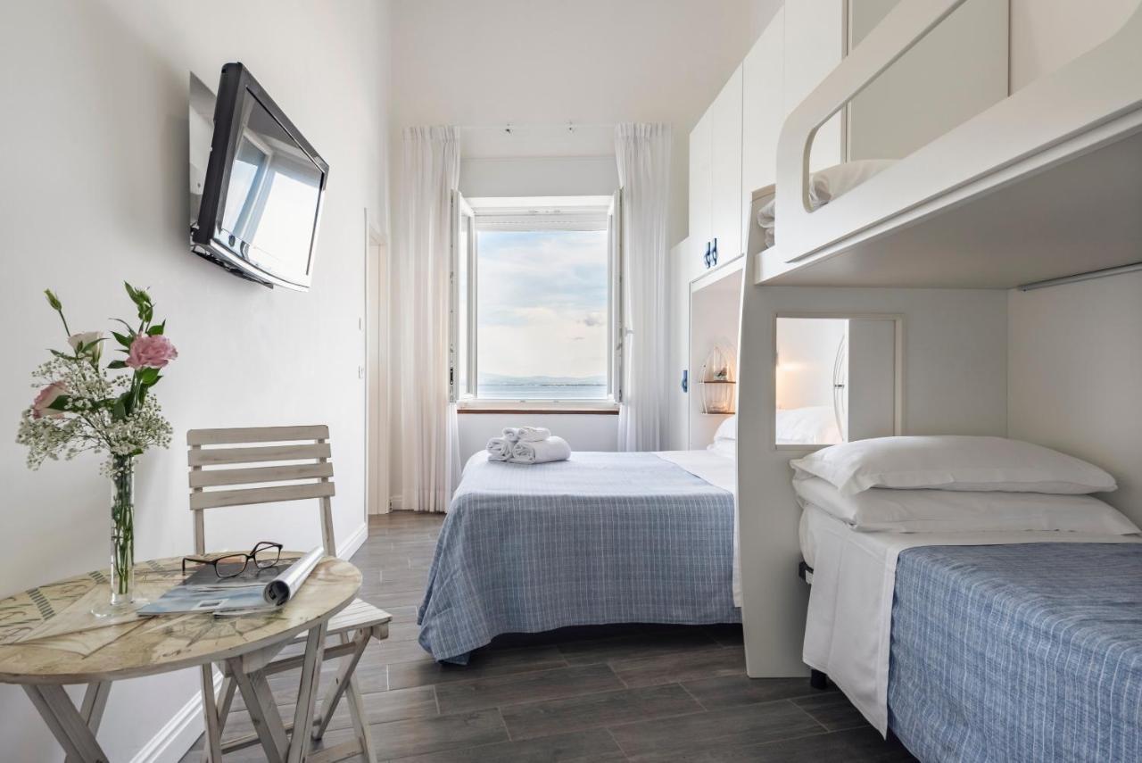 Hotel La Caletta Порто Санто Стефано Экстерьер фото
